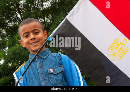 London, UK. 17th Aug, 2013.  A child displays his flag as over 100 British Egyptians hold a drive-by protest  on the streets of London against the military coup and subsequent violence in Egypt Credit:  Paul Davey/Alamy Live News Stock Photo