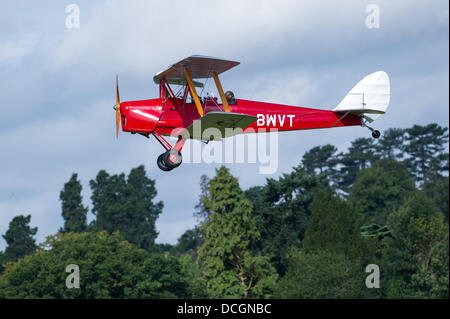 Woburn Abbey, Bedfordshire, UK - 17 August 2013. A Tiger Moth in flight at the de Havilland Moth Club's 28th International Moth Rally at Woburn Abbey Stock Photo