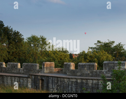 Early morning light on the ancient old walled  town York City Walls hot air balloon baloon in background Yorkshire England Stock Photo