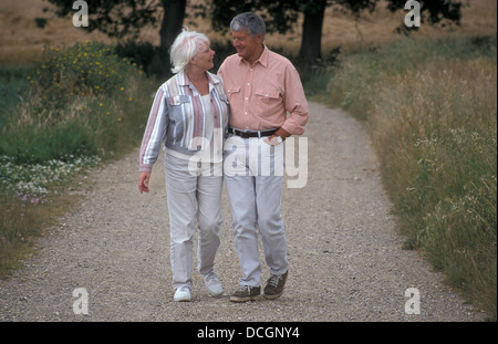 mature couple walking in countryside Stock Photo