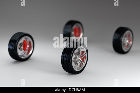 3D render of four car wheels on gray background Stock Photo