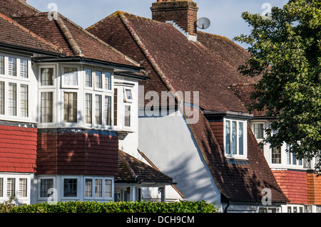 Close up of typical 1930s house tops, in a side road, just off the High Street in Banstead, Surrey, England, UK. Stock Photo