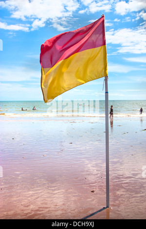 safety flag on uk beach allowing swimming Stock Photo