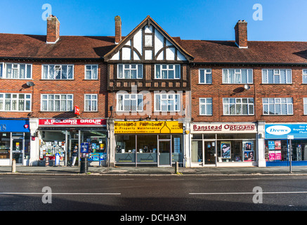 Parade of shops on Banstead village High Street, on a quiet Sunday ...