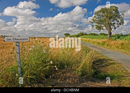 'Les Chaussoirs' a typical rural French road sign indicating a property or family. Stock Photo
