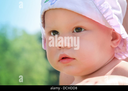 Little baby girl closeup outdoor portrait Stock Photo