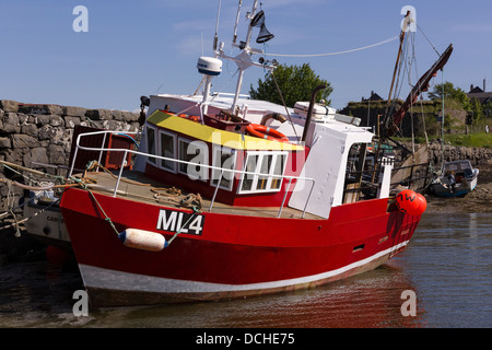 Modern small red and white fishing boat / trawler moored at Broadford Pier, Broadford, Isle of Skye, Scotland, UK
