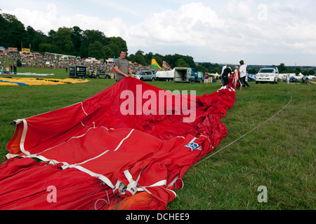 Balloons laid out in preparation for inflation at the 35th Bristol International Balloon Fiesta. Bristol, England, UK. Stock Photo