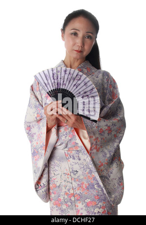 Japanese Lady Wearing a Pink and Lilac Patterned Kimono and Holding a Fan