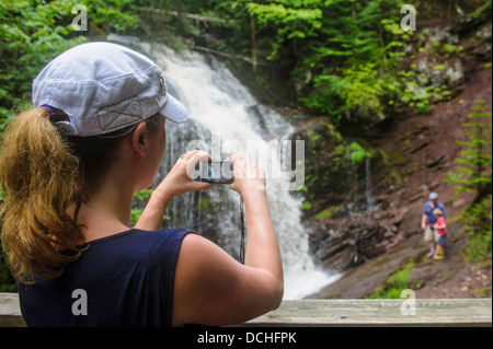 Mother taking photograph of her husband and son at Fuller Falls New Brunswick Stock Photo