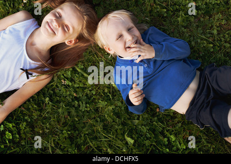 happy cute children on the grass Stock Photo