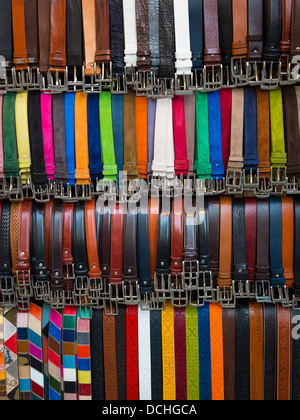 Leather belts for sale in street market in Florence, Italy Stock Photo