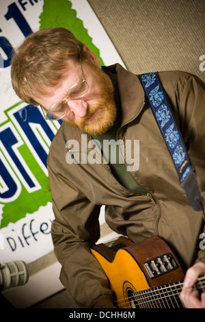 Recording artist David Lowery of the band Cracker performs with his guitar in a radio studio on March 2, 2007 in Charlottesville, VA. Stock Photo