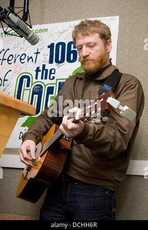 Recording artist David Lowery of the band Cracker performs with his guitar in a radio studio on March 2, 2007 in Charlottesville, VA. Stock Photo