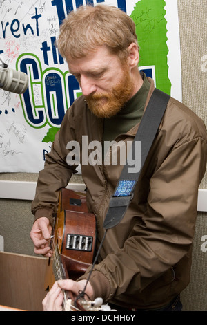 Recording artist David Lowery of the band Cracker performs with his guitar in a radio studio on March 2, 2007 in Charlottesville, VA. Stock Photo