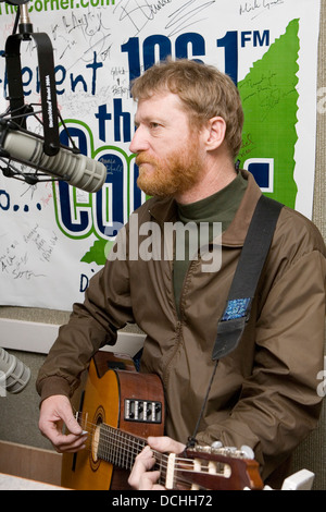 Recording artist David Lowery of the band Cracker performs with his guitar in a radio studio on March 2, 2007 in Charlottesville, VA. Stock Photo