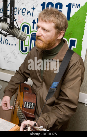 Recording artist David Lowery of the band Cracker performs with his guitar in a radio studio on March 2, 2007 in Charlottesville, VA. Stock Photo