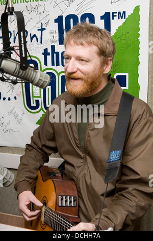 Recording artist David Lowery of the band Cracker performs with his guitar in a radio studio on March 2, 2007 in Charlottesville, VA. Stock Photo