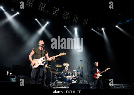 The Police lead vocalist Sting (Gordon Sumner, left), drummer Stewart Copeland (center), and guitarist Andy Summers (right) performs in Charlottesville, VA on November 6, 2007. Stock Photo