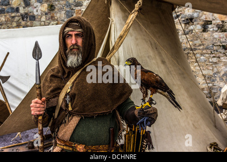 Hunter Gathers with Hawk and spear Stock Photo