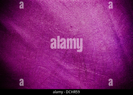 Holed and creased purple, violet or pink canvas background or texture Stock Photo