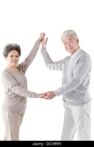 Oriental old couple dancing Stock Photo
