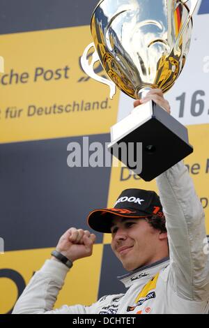 Nuerburg, Germany. 18th Aug, 2013. Canadian Mercedes driver Robert Wickens cheers after winning the German Touring Car Masters (DTM) qualification at the Nuerburgring racing curcuit near Nuerburg, Germany, 18 August 2013. Photo: Thomas Frey/dpa/Alamy Live News Stock Photo