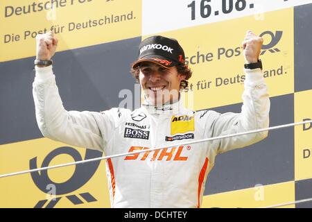 Nuerburg, Germany. 18th Aug, 2013. Canadian Mercedes driver Robert Wickens cheers after winning the German Touring Car Masters (DTM) qualification at the Nuerburgring racing curcuit near Nuerburg, Germany, 18 August 2013. Photo: Thomas Frey/dpa/Alamy Live News Stock Photo