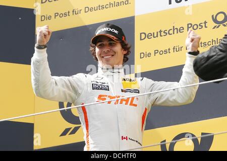 Nuerburg, Germany. 18th Aug, 2013. Canadian Mercedes driver Robert Wickens cheers after winning the German Touring Car Masters (DTM) qualification at the Nuerburgring racing curcuit near Nuerburg, Germany, 18 August 2013. Photo: Thomas Frey/dpa/Alamy Live News Stock Photo