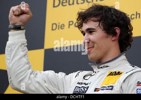 Nuerburg, Germany. 18th Aug, 2013. Canadian Mercedes driver Robert Wickens cheers after winning the German Touring Car Masters (DTM) qualification at the Nuerburgring racing curcuit near Nuerburg, Germany, 18 August 2013. Photo: Thomas Frey/dpa/Alamy Live News Stock Photo