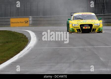 Nuerburg, Germany. 18th Aug, 2013. German Audi driver Mike Rockefeller in action at the German Touring Car Masters (DTM) qualification at the Nuerburgring racing curcuit near Nuerburg, Germany, 18 August 2013. Photo: Thomas Frey/dpa/Alamy Live News Stock Photo