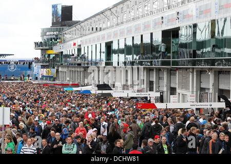 Nuerburg, Germany. 18th Aug, 2013. The pit lane is crowded during a pit walk at the German Touring Car Masters (DTM) qualification at the Nuerburgring racing curcuit near Nuerburg, Germany, 18 August 2013. Photo: Thomas Frey/dpa/Alamy Live News Stock Photo