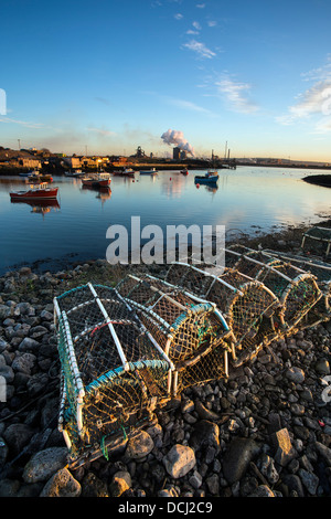 Crab pots and Steel Works, Paddys Hole, Redcar, Cleveland Stock Photo