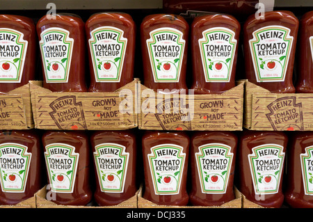 Bottles of Heinz Tomato Ketchup on a supermarket shelf. Stock Photo