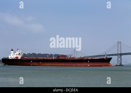 The Orion Voyager, a Chevron Oil Tanker passes under the Bay Bridge, San Francisco, California, United States of America Stock Photo