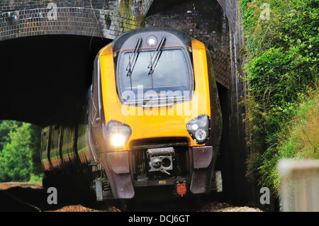 Crosscountry voyager high speed train exits Kennaway railway tunnel at Dawlish in Devon Stock Photo