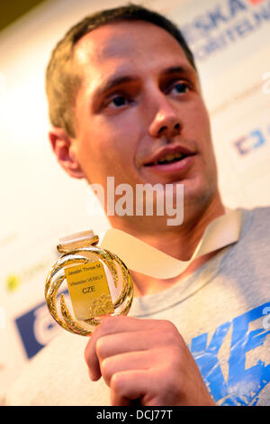 Prague, Czech Republic. 19th Aug, 2013. Czech javelin thrower Vitezslav Vesely poses with this gold medal from the World Athletics Championships in Prague, Czech Republic, August 19, 2013. Credit:  Roman Vondrous/CTK Photo/Alamy Live News Stock Photo