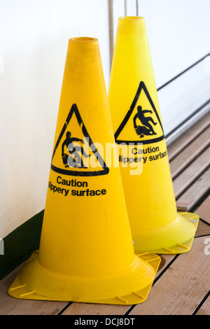 Industrial warning cones. Caution slippery surface. Stock Photo