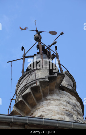 Bell tower with weather vane at the medieval city gate of Sommieres, Gard, France Stock Photo