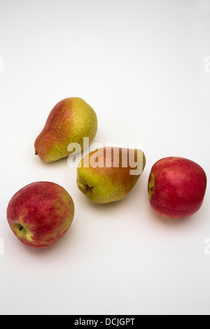 Two rosy apples and two rosy pears against a white background. Stock Photo