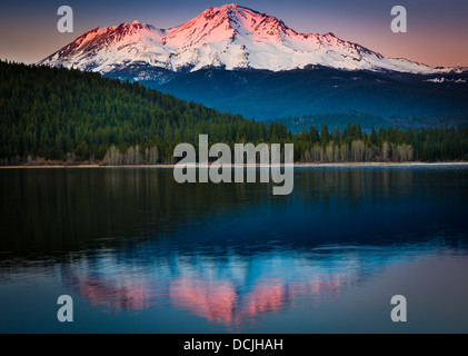 Mount Shasta reflecting in nearby Lake Siskiyou, California Stock Photo