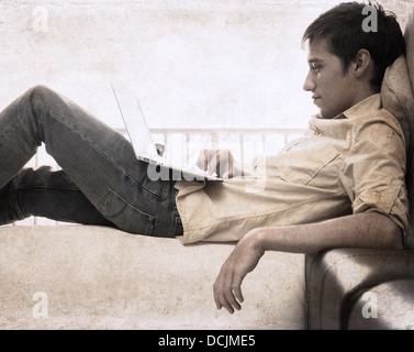 artwork in grunge style, boy with laptop Stock Photo