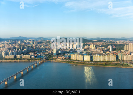 Seoul, South Korea evening cityscape, with the Han River in the foreground, and Namsam Tower (Seoul Tower) in the background. Stock Photo