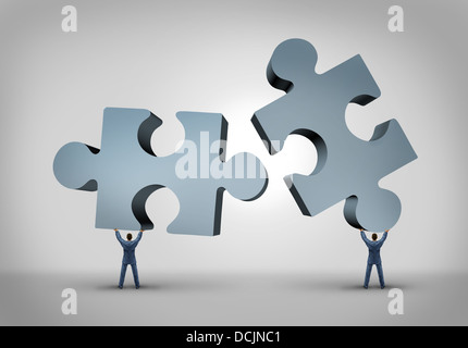 Teamwork and leadership business concept with two giant three dimensional puzzle pieces coming together from a partnership agreement between two powerful leaders who are building a successful company. Stock Photo