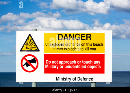 Warning signs for unexploded bombs on the coast at Aldbrough, Yorkshire, UK. Stock Photo