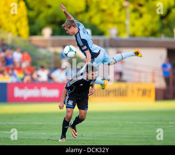 Santa Clara, CA. 18th Aug, 2013. August 18, 2013: Sporting KC defender Chance Myers (7) draws a yellow card for leaping on the back of San Jose Earthquakes forward Chris Wondolowski (8) during the MLS soccer game between the San Jose Earthquakes and Sporting Kansas City at Buck Shaw Stadium in Santa Clara, CA. The Earthquakes defeated Kansas City 1-0. © Cal Sport Media/Alamy Live News