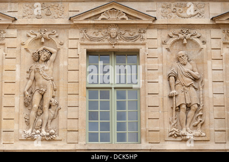 Relief sculpture at 17th century Hôtel de Sully (former home of duc de Sully), Marais district, Paris, France Stock Photo