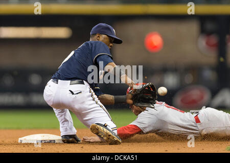 Milwaukee, Wisconsin, USA. 19th Aug, 2013. August 19, 2013: St. Louis Cardinals second baseman Kolten Wong #16 steals second base and slides under the tag of Milwaukee Brewers shortstop Jean Segura #9 during the Major League Baseball game between the Milwaukee Brewers and the St. Louis Cardinals at Miller Park in Milwaukee, WI. Cardinals lead the Brewers 8-5 in the 9th inning. John Fisher/CSM. © csm/Alamy Live News Stock Photo