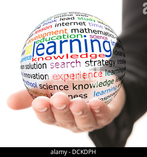 Transparent ball with inscription learning in a hand Stock Photo