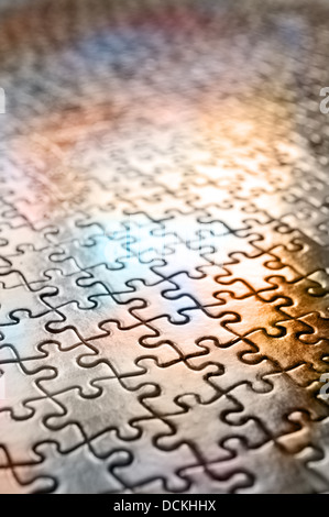 Jigsaw puzzle interlocking pieces pattern to solve meshed together in one correct outcome as each piece a unique shape Stock Photo